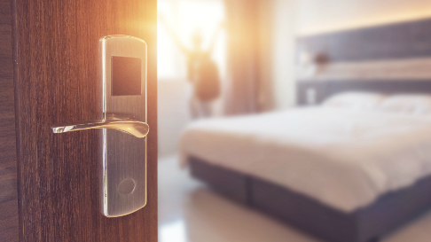 Hotel room with bed and door