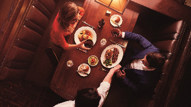 Two people sitting and dining